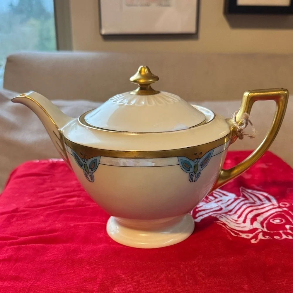 Elegant Gold and Cream Teapot with Blue Accents